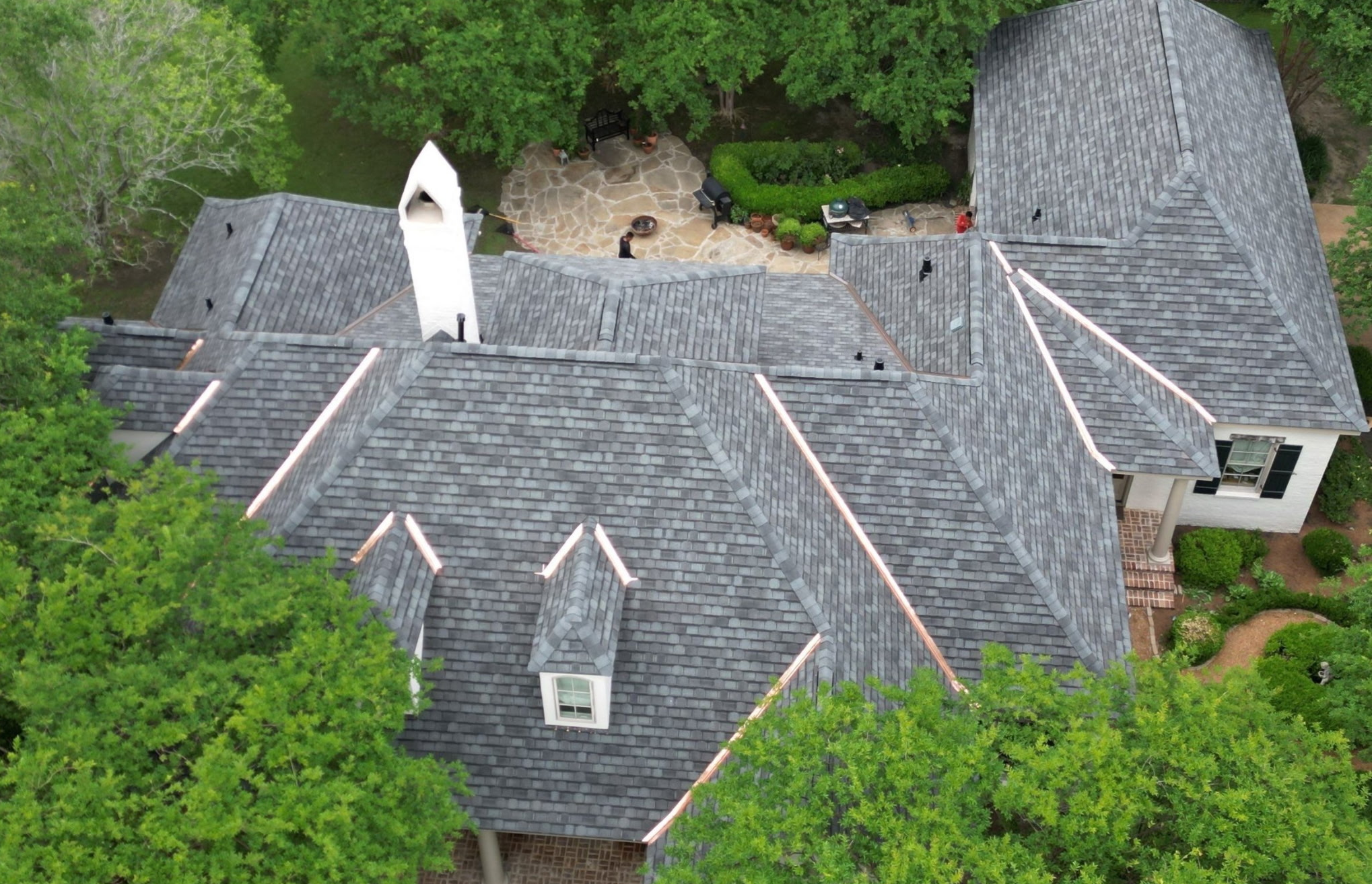 gray roof surrouded-by trees